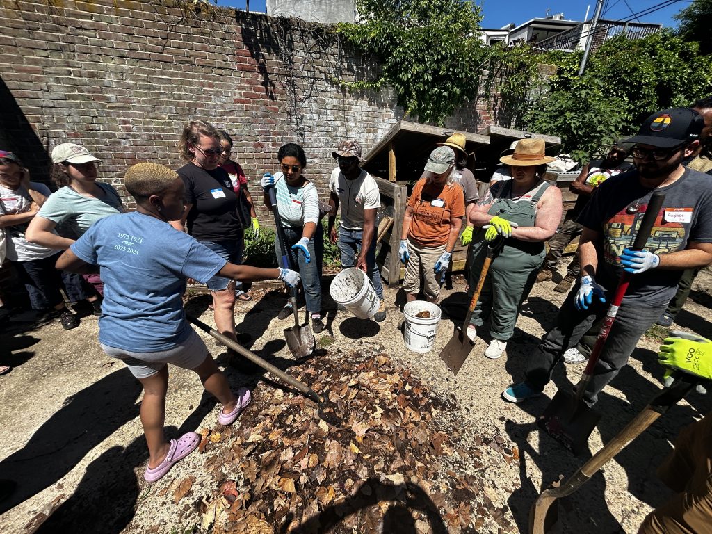 Community learning about composting process.
